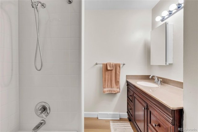 7933 Chase Cir Unit 182, Arvada, CO 80003 - bathroom with vanity, shower / tub combination, and wood finished floors
