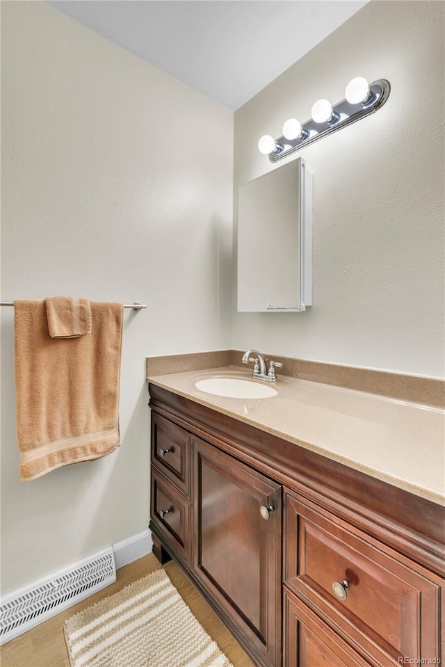 7933 Chase Cir Unit 182, Arvada, CO 80003 - bathroom featuring vanity and wood finished floors