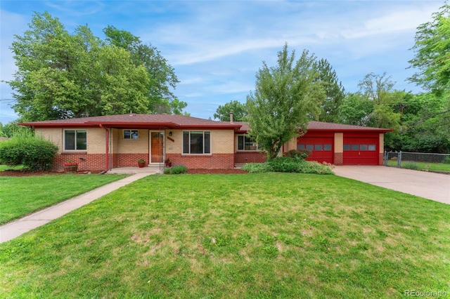 8675 Calvin Dr, Arvada, CO 80002 - single story home featuring brick siding, an attached garage, and concrete driveway