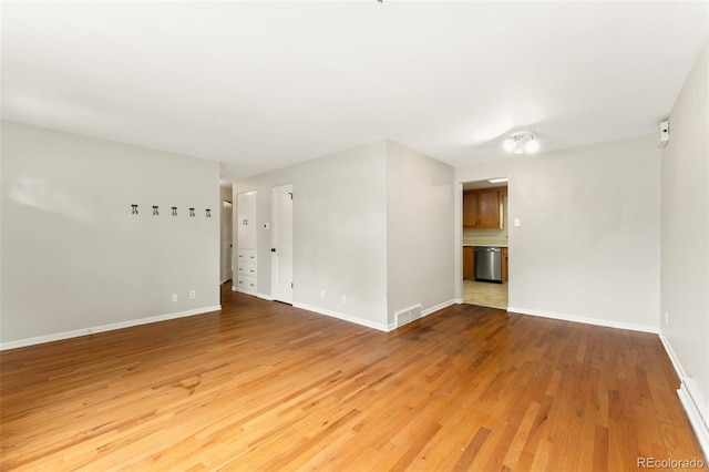 8675 Calvin Dr, Arvada, CO 80002 - empty room featuring wood finished floors and baseboards