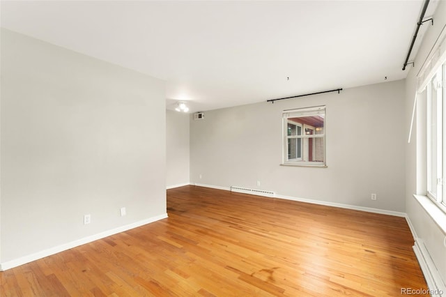 8675 Calvin Dr, Arvada, CO 80002 - spare room with light wood-style flooring and plenty of natural light