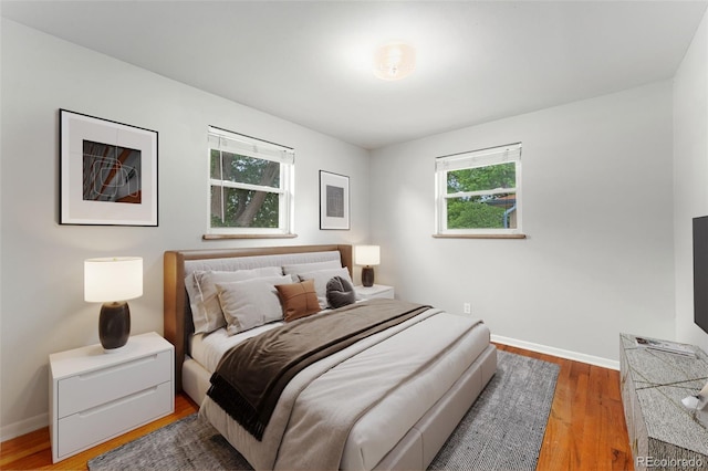 8675 Calvin Dr, Arvada, CO 80002 - bedroom with wood finished floors and baseboards