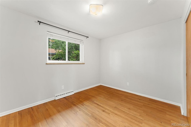 8675 Calvin Dr, Arvada, CO 80002 - spare room featuring light wood-type flooring and a smoke detector