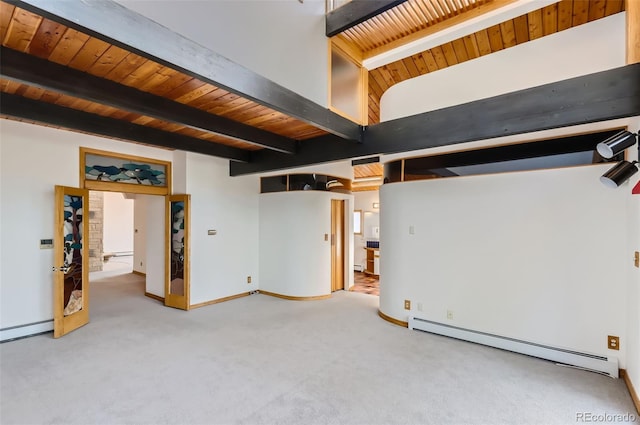 basement featuring carpet flooring, a baseboard heating unit, and wooden ceiling