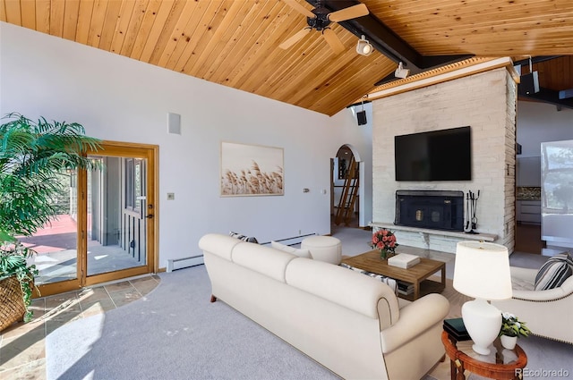 living room with ceiling fan, wood ceiling, a fireplace, beam ceiling, and baseboard heating