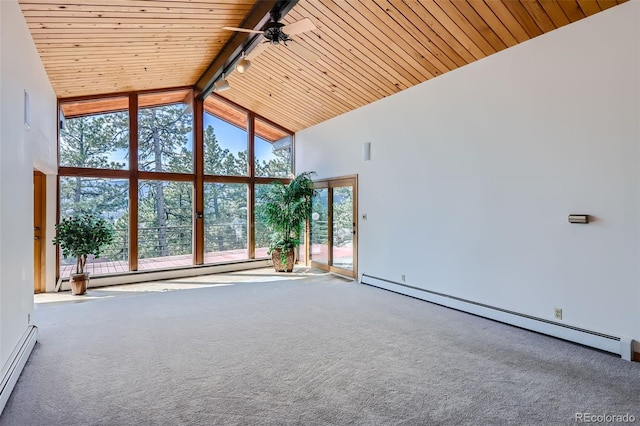 unfurnished living room featuring a baseboard radiator, wood ceiling, beam ceiling, and a wealth of natural light