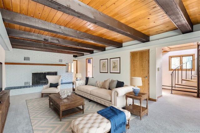 carpeted living room featuring beamed ceiling, a fireplace, wood ceiling, and brick wall