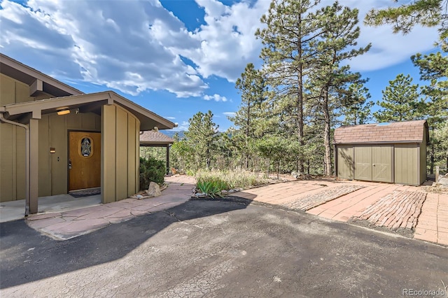 exterior space with a shed