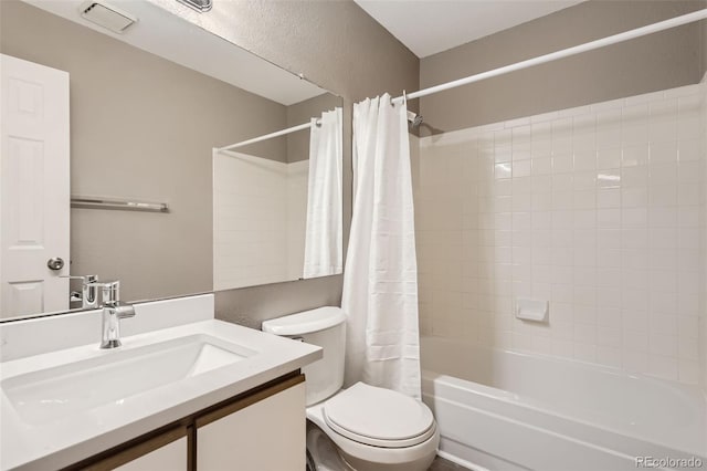 full bathroom featuring shower / bathtub combination with curtain, vanity, and toilet