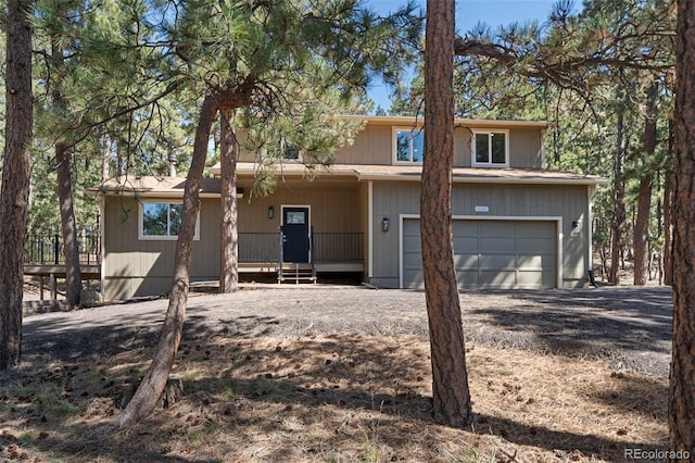 view of front of property featuring a porch and a garage