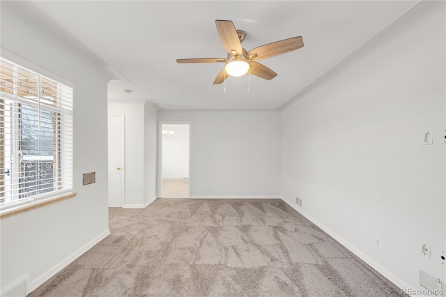 carpeted empty room with ceiling fan