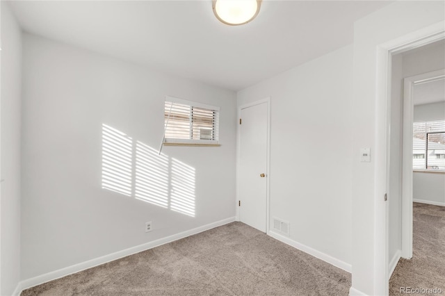 view of carpeted spare room