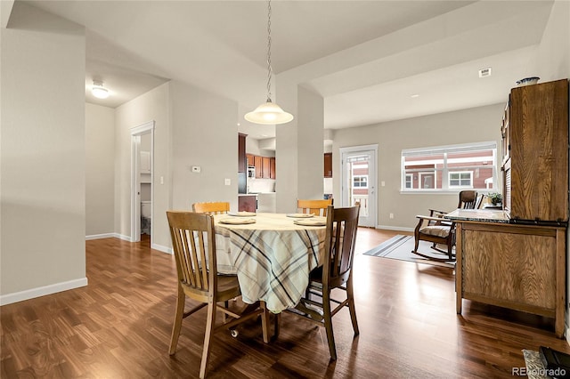 18061 E Saskatoon Pl, Parker, CO 80134 - dining area with dark wood-type flooring and baseboards