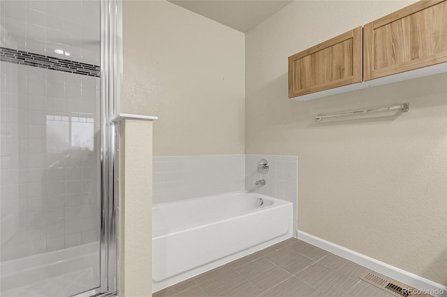 18061 E Saskatoon Pl, Parker, CO 80134 - bathroom featuring a garden tub and a stall shower