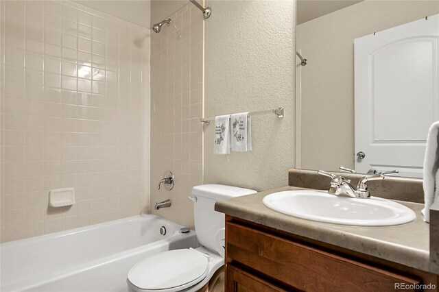 18061 E Saskatoon Pl, Parker, CO 80134 - full bathroom with a textured wall, vanity, and washtub / shower combination