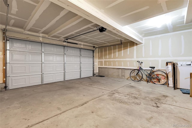18061 E Saskatoon Pl, Parker, CO 80134 - garage with washer / clothes dryer and a garage door opener