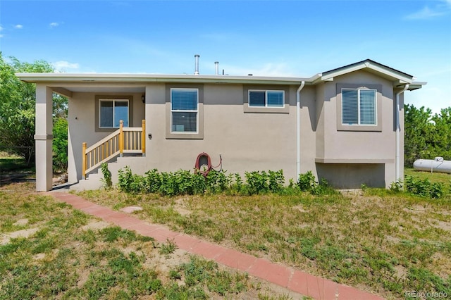 4750 County Road B, Wiggins, CO 80654 - view of front of property featuring stucco siding and a front lawn
