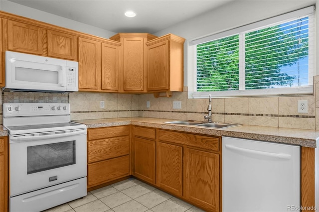 4750 County Road B, Wiggins, CO 80654 - kitchen with white appliances, light countertops, backsplash, and light tile patterned floors