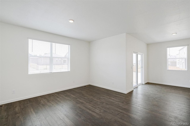 unfurnished room featuring dark hardwood / wood-style floors