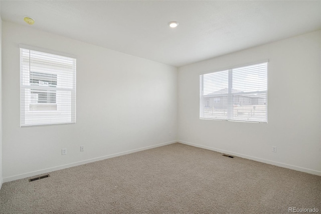 unfurnished room featuring carpet flooring