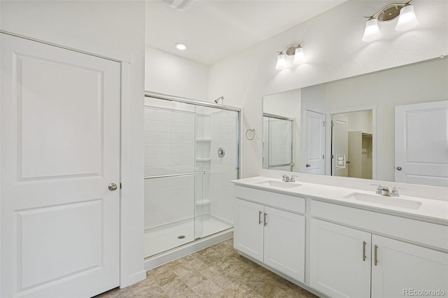 bathroom with vanity and an enclosed shower