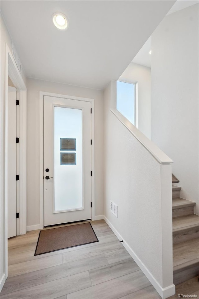 doorway to outside featuring light hardwood / wood-style flooring