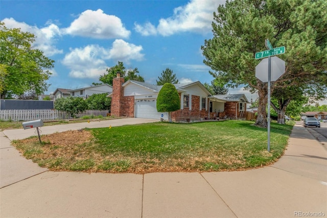 16699 E 7th Ave, Aurora, CO 80011 - ranch-style house featuring brick siding, concrete driveway, and an attached garage