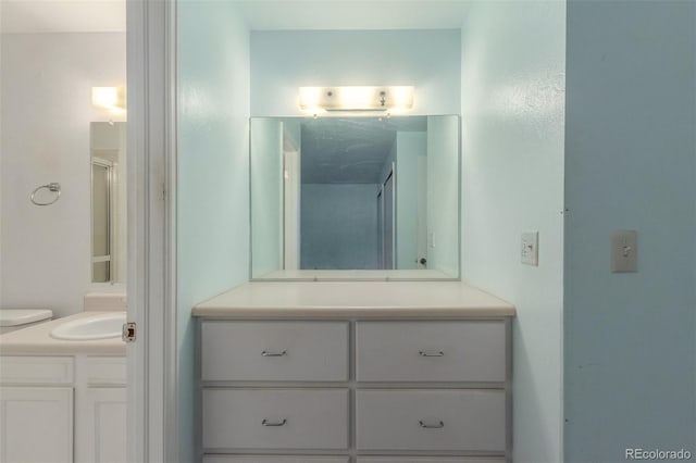 16699 E 7th Ave, Aurora, CO 80011 - bathroom featuring vanity and a shower