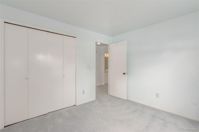 16699 E 7th Ave, Aurora, CO 80011 - unfurnished bedroom featuring light carpet and a closet