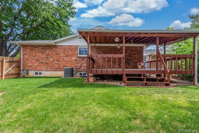 16699 E 7th Ave, Aurora, CO 80011 - rear view of property with brick siding and a wooden deck