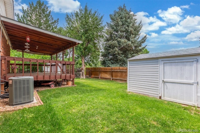 16699 E 7th Ave, Aurora, CO 80011 - fenced backyard featuring a storage unit and a wooden deck