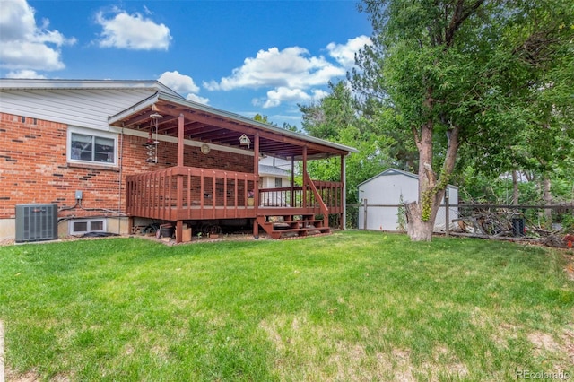 16699 E 7th Ave, Aurora, CO 80011 - rear view of property featuring a wooden deck and brick siding
