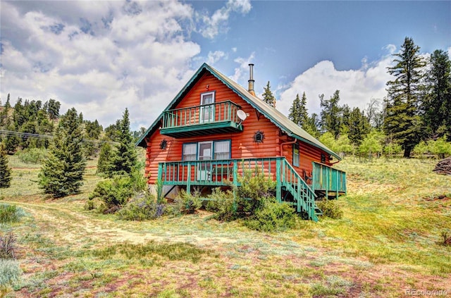 446 Chief Trl, Como, CO 80456 - view of front of property with log siding and a wooden deck