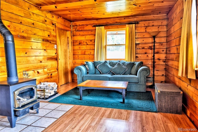 446 Chief Trl, Como, CO 80456 - living area featuring wood ceiling, a wood stove, wood finished floors, and wood walls