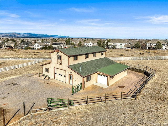 bird's eye view featuring a rural view and a mountain view