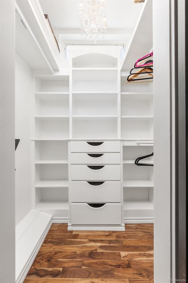 1669 Apple Valley Rd, Lyons, CO 80540 - walk in closet with wood finished floors