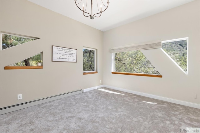 1669 Apple Valley Rd, Lyons, CO 80540 - carpeted empty room with baseboard heating, a chandelier, and baseboards