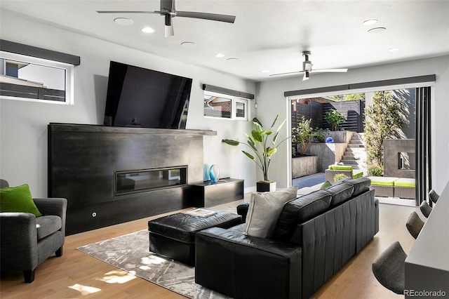 3453 Navajo St, Denver, CO 80211 - living area with a glass covered fireplace, a ceiling fan, light wood-style flooring, and recessed lighting