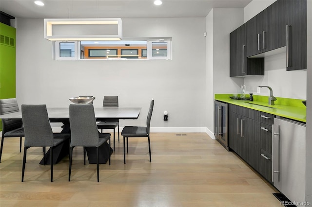 3453 Navajo St, Denver, CO 80211 - dining room with beverage cooler, light wood-style flooring, baseboards, and recessed lighting