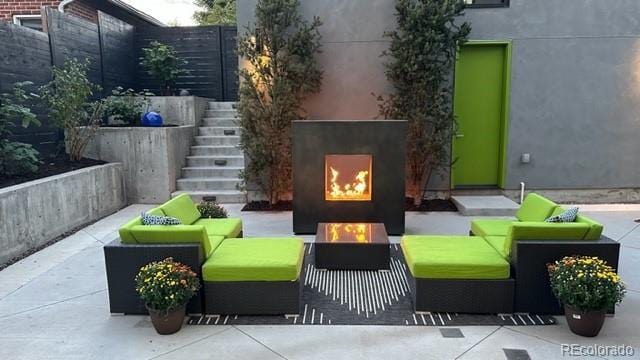 3453 Navajo St, Denver, CO 80211 - view of patio with stairway and an outdoor living space with a fireplace