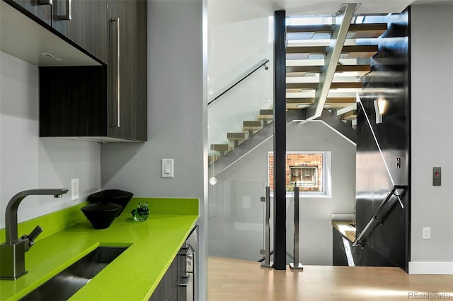 3453 Navajo St, Denver, CO 80211 - kitchen with a sink, modern cabinets, light countertops, and wood finished floors
