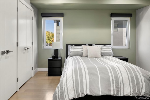 3453 Navajo St, Denver, CO 80211 - bedroom featuring light wood-style flooring, baseboards, and a closet