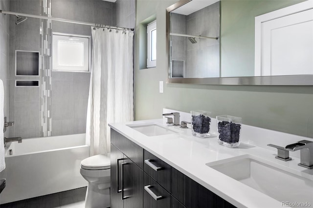 3453 Navajo St, Denver, CO 80211 - bathroom with toilet, shower / bath combo with shower curtain, double vanity, and tile patterned flooring