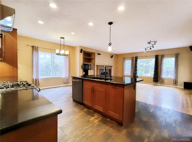 10154 Fairgate Way, Highlands Ranch, CO 80126 - kitchen featuring a sink, stainless steel dishwasher, dark countertops, dark wood finished floors, and open floor plan