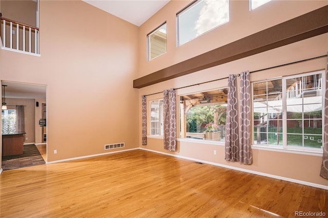10154 Fairgate Way, Highlands Ranch, CO 80126 - unfurnished room with light wood-style floors and a high ceiling