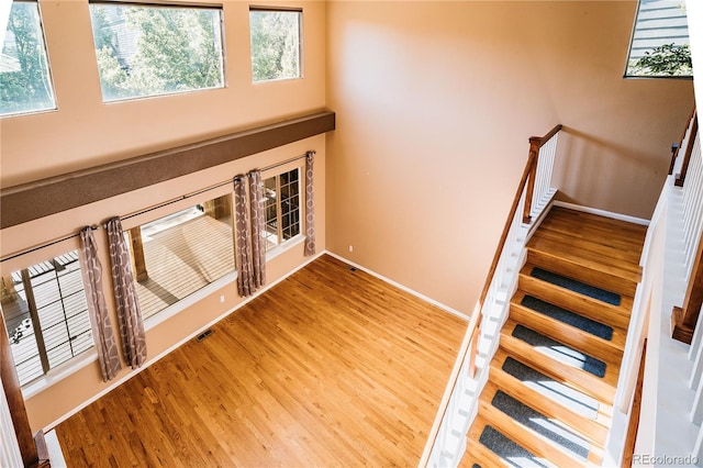 10154 Fairgate Way, Highlands Ranch, CO 80126 - staircase with baseboards and wood finished floors