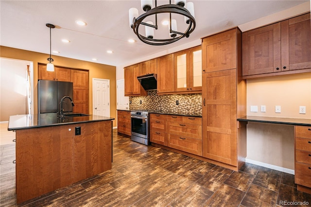 10154 Fairgate Way, Highlands Ranch, CO 80126 - kitchen with stainless steel range, freestanding refrigerator, dark countertops, brown cabinets, and recessed lighting