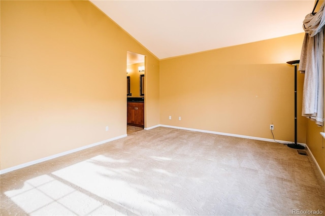 10154 Fairgate Way, Highlands Ranch, CO 80126 - unfurnished room featuring vaulted ceiling and light colored carpet