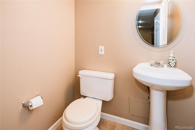 10154 Fairgate Way, Highlands Ranch, CO 80126 - half bath featuring toilet and tile patterned flooring