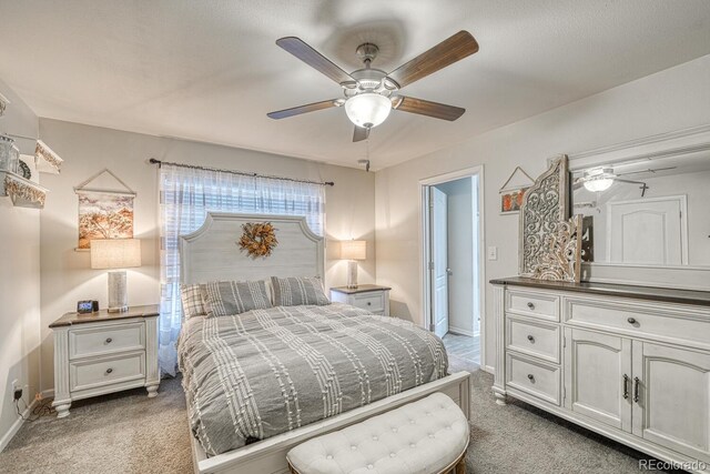 310 Chipeta Ave, Poncha Springs, CO 81242 - bedroom with light carpet, baseboards, and a ceiling fan